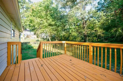 a front view of house with yard and trees
