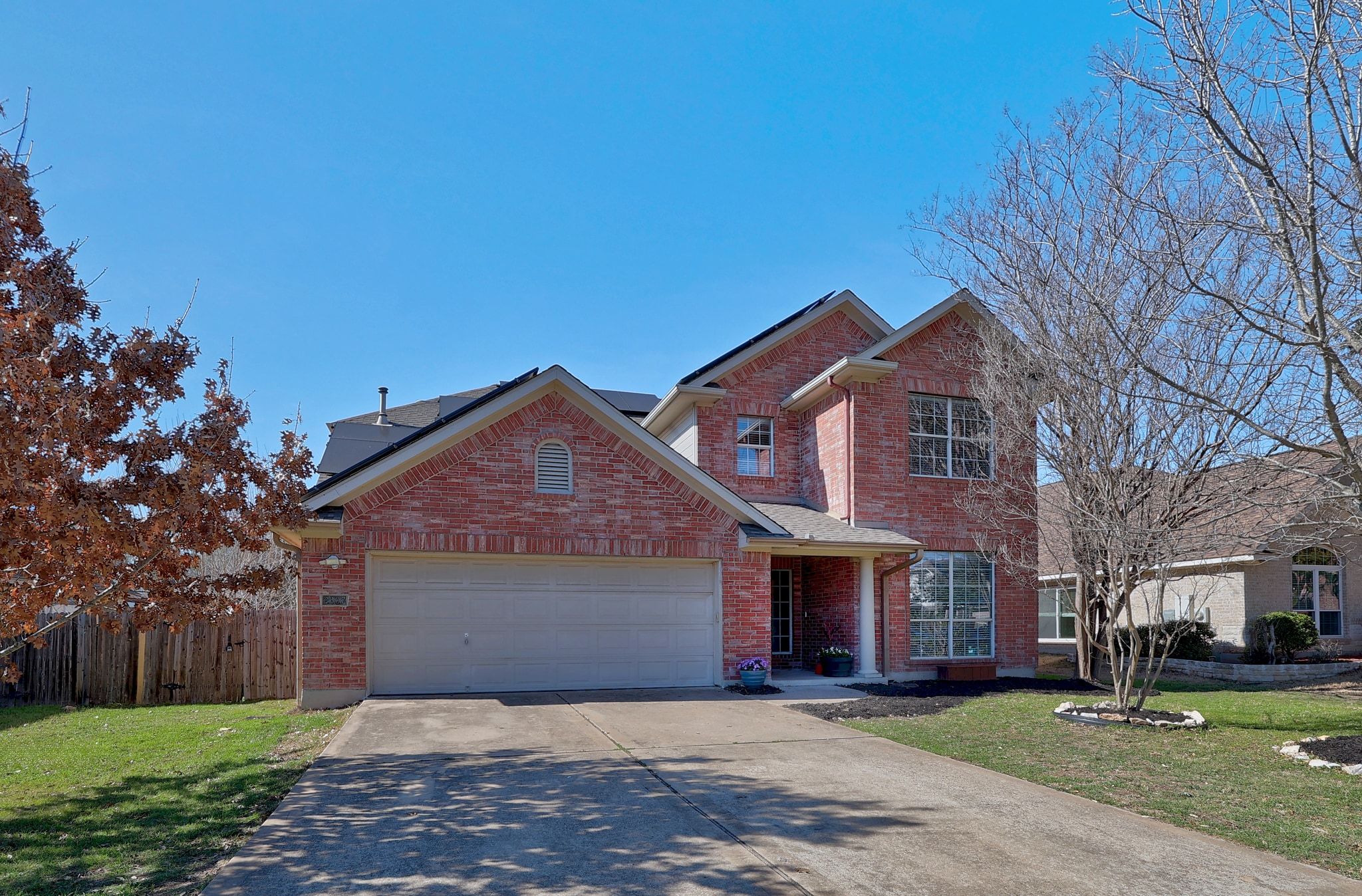 2307 Hayfield Square Pflugerville, TX 78660 - Photo 1 of 40 a front view of a house with a yard and garage
