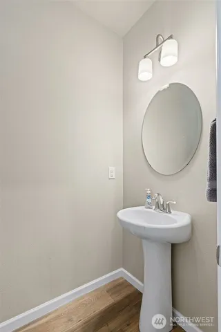 a bathroom with a sink a mirror and vanity