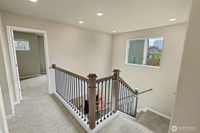 a view of a hallway with windows