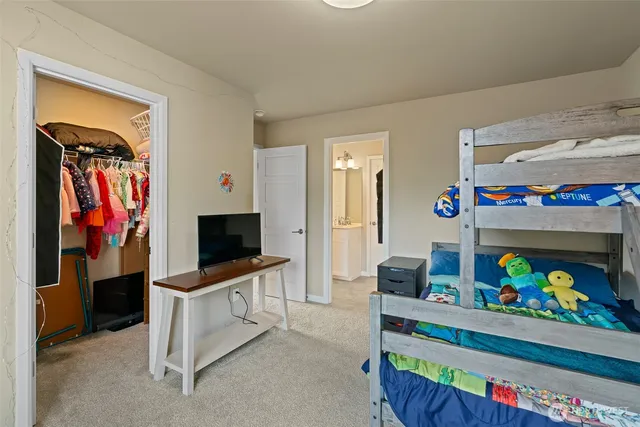 a room with furniture and a flat screen tv