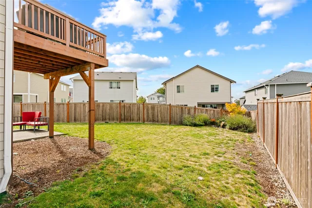 a house view with a backyard space