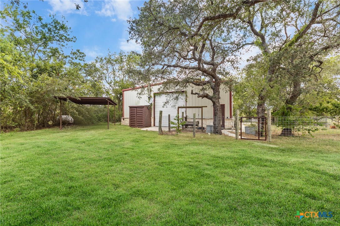 218 Alexandra Lane Dale, TX 78616 - Photo 2 of 44 a view of a large garden with plants and large trees