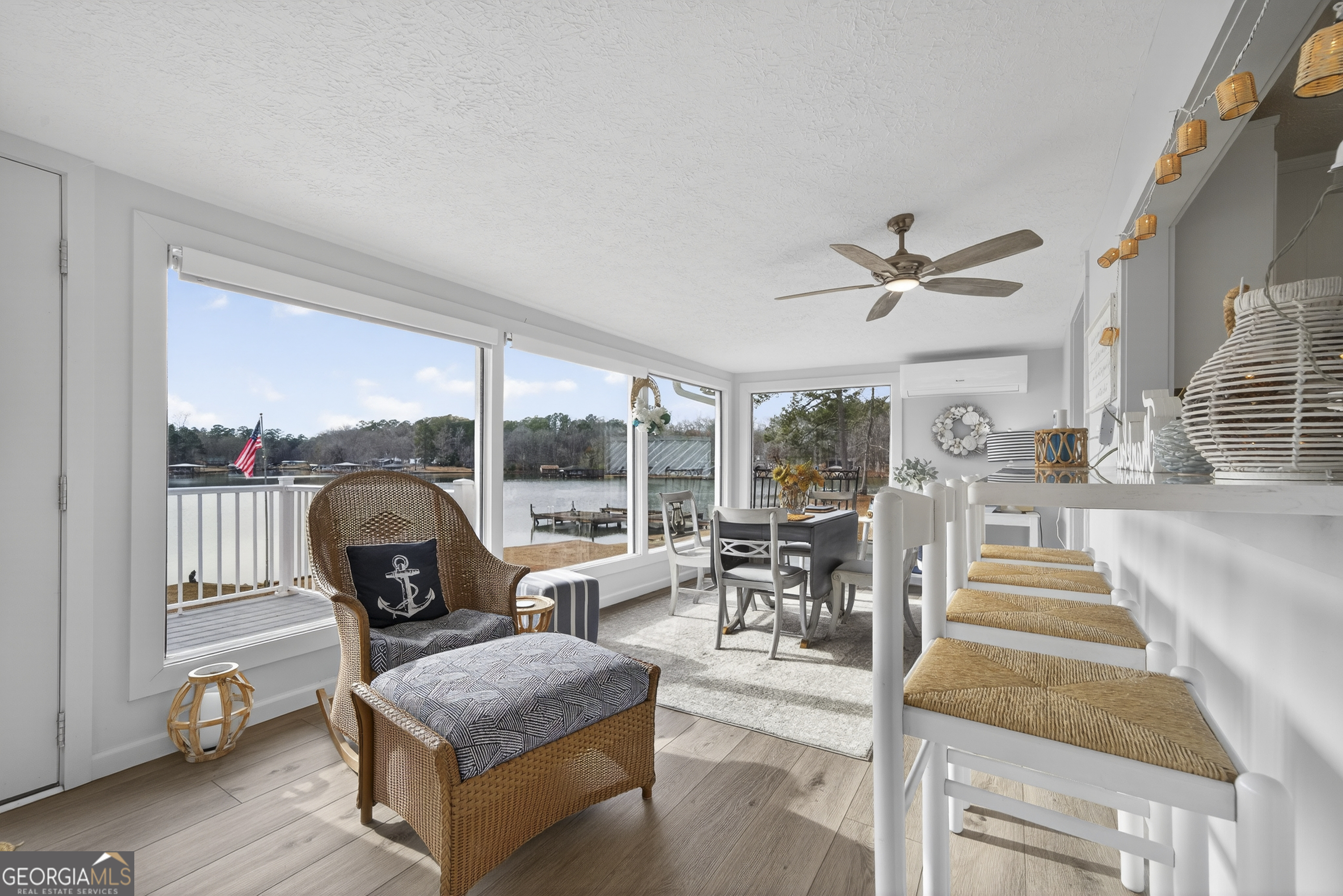 285 Clubhouse Road Eatonton, GA 31024 - Photo 12 of 44 a living room with furniture and a large window