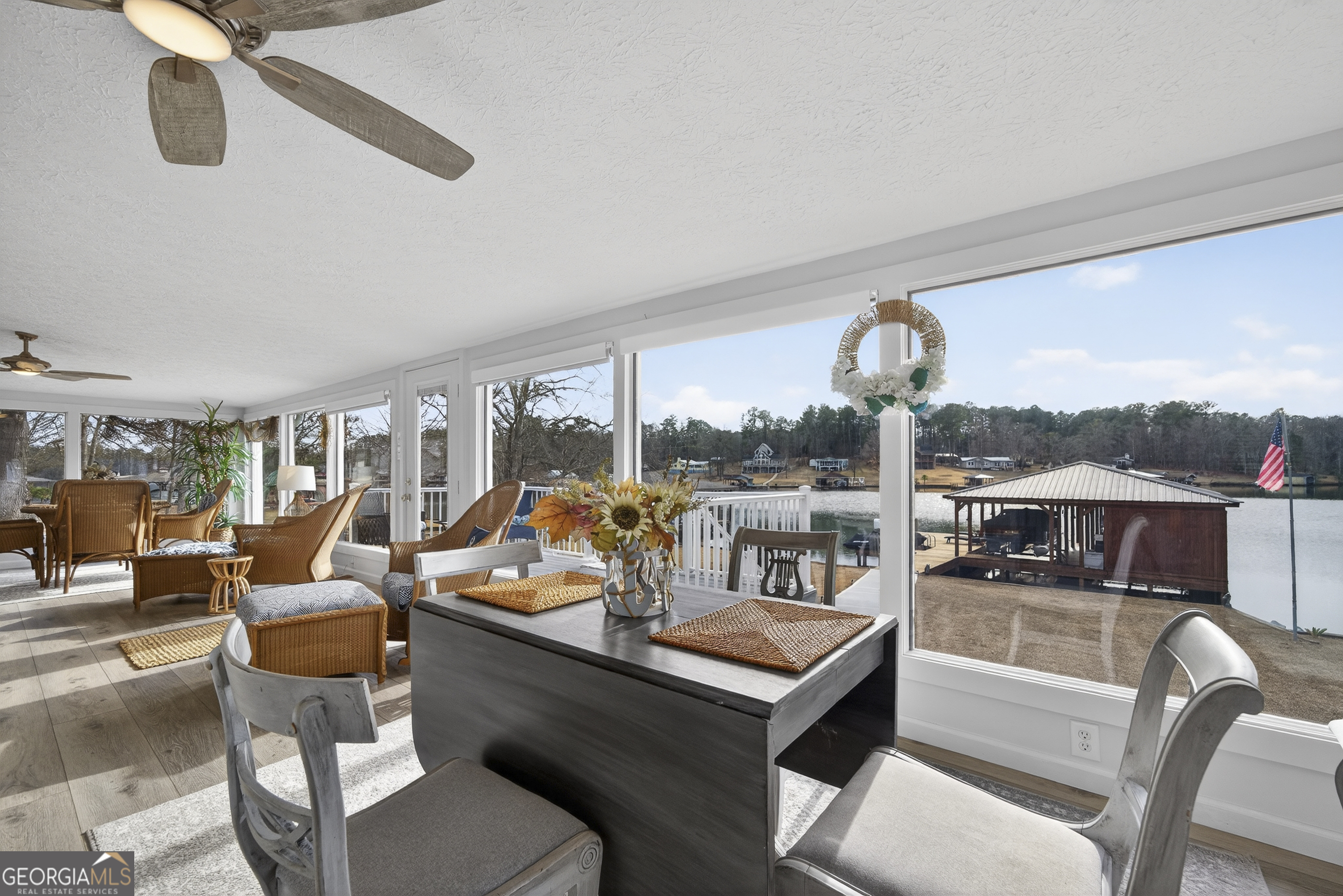 285 Clubhouse Road Eatonton, GA 31024 - Photo 13 of 44 a living room with furniture and a large window