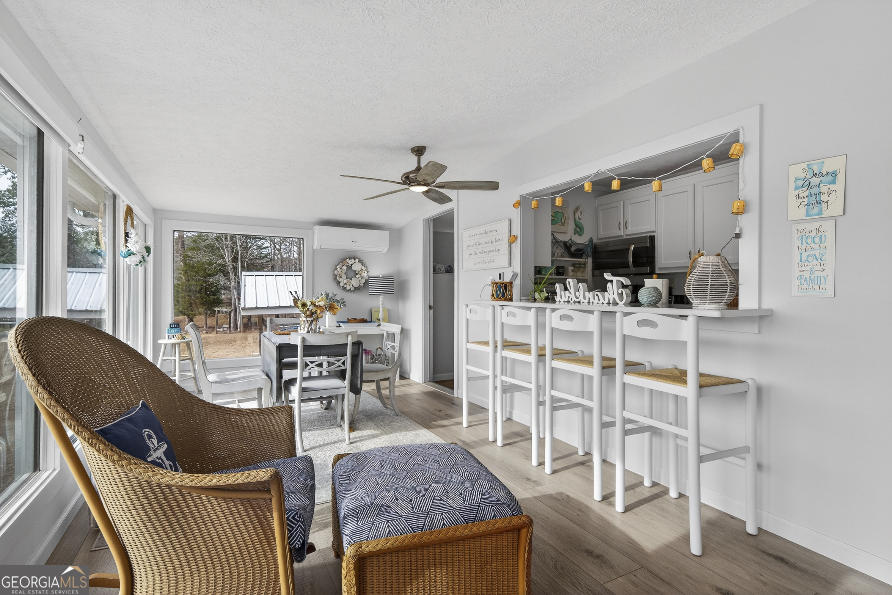 285 Clubhouse Road Eatonton, GA 31024 - Photo 14 of 44 a living room with furniture a flat screen tv and a table