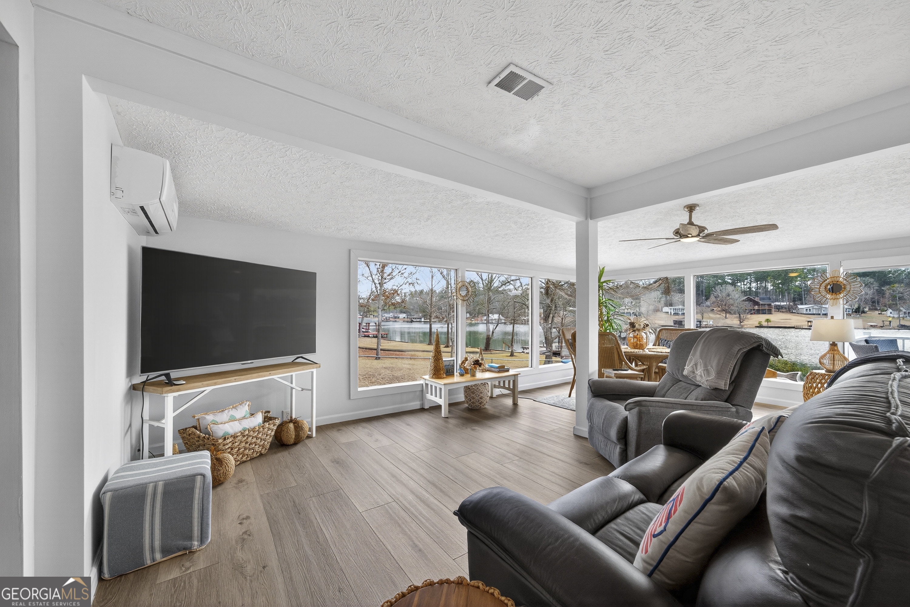285 Clubhouse Road Eatonton, GA 31024 - Photo 17 of 44 a living room with furniture and a flat screen tv