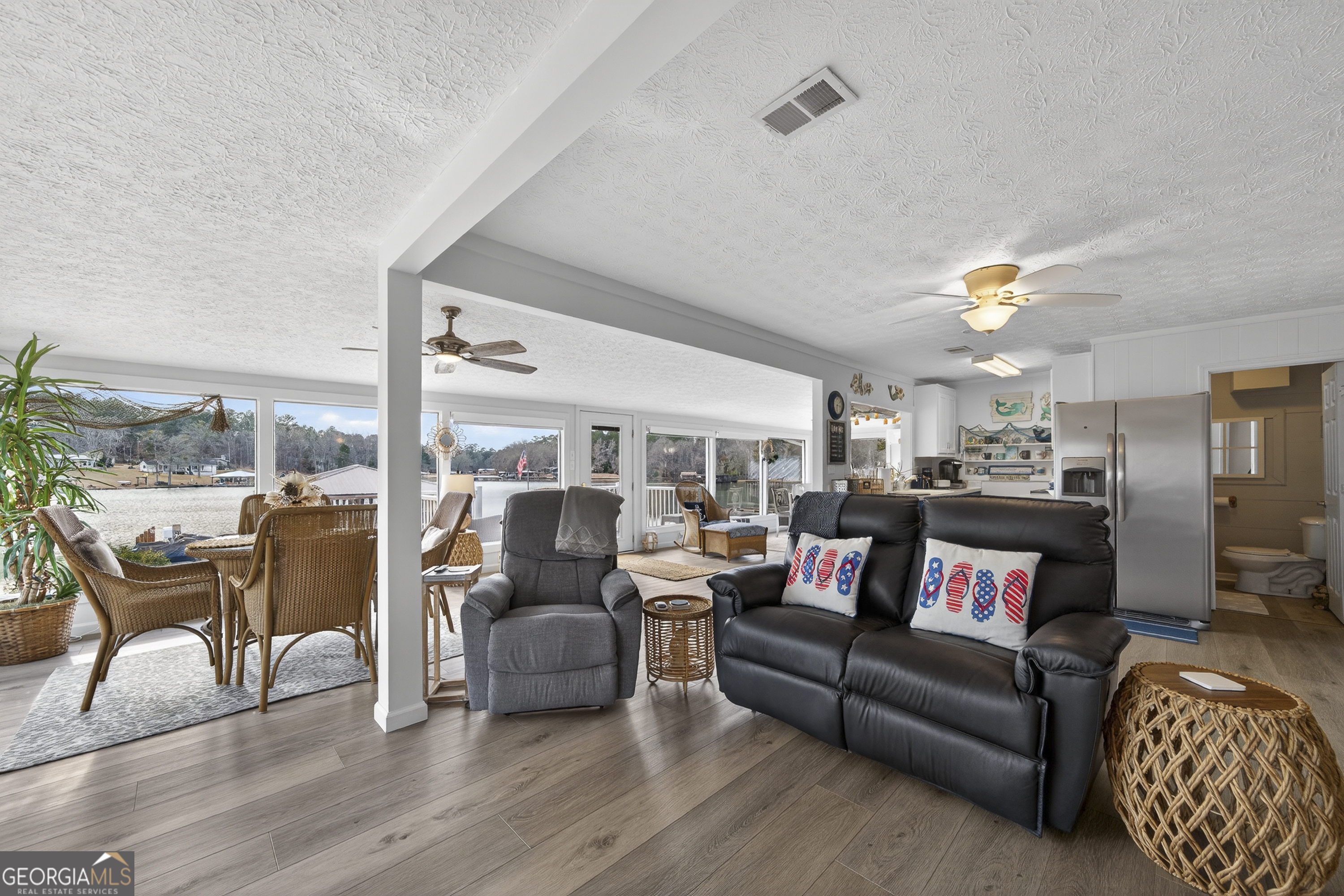 285 Clubhouse Road Eatonton, GA 31024 - Photo 18 of 44 a living room with furniture and a large window