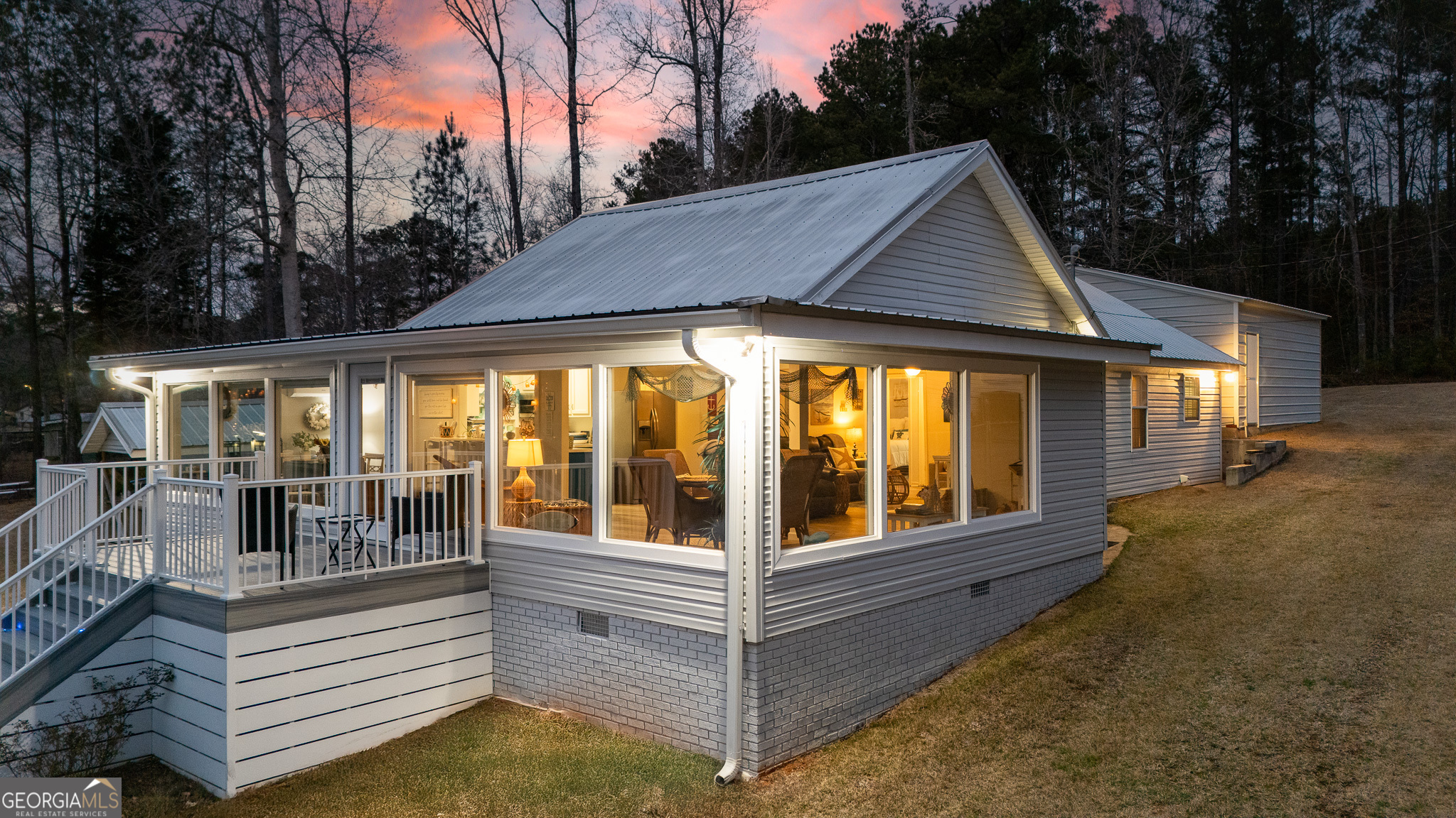 285 Clubhouse Road Eatonton, GA 31024 - Photo 2 of 44 a view of a house with backyard and porch
