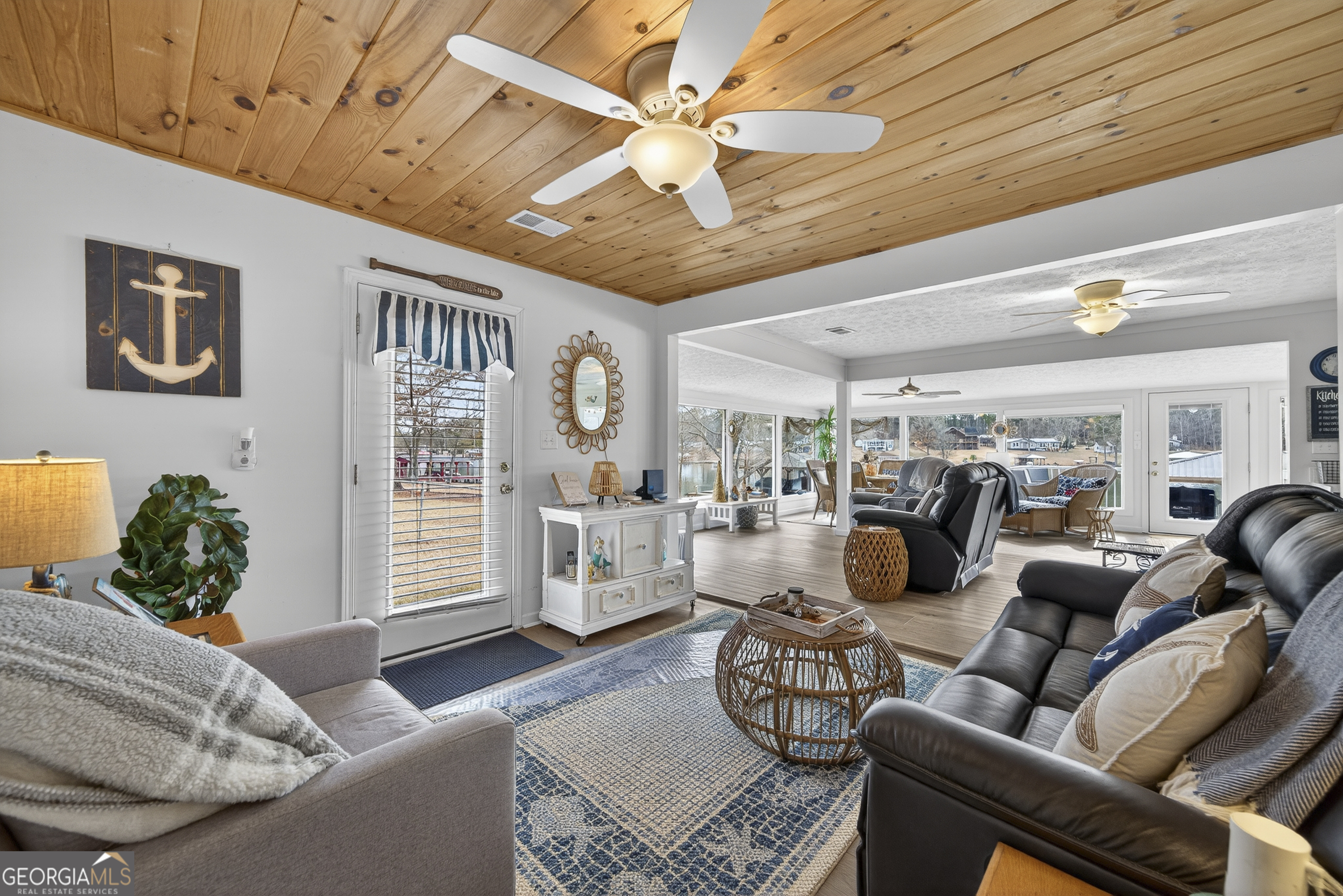 285 Clubhouse Road Eatonton, GA 31024 - Photo 25 of 44 a living room with furniture and a window