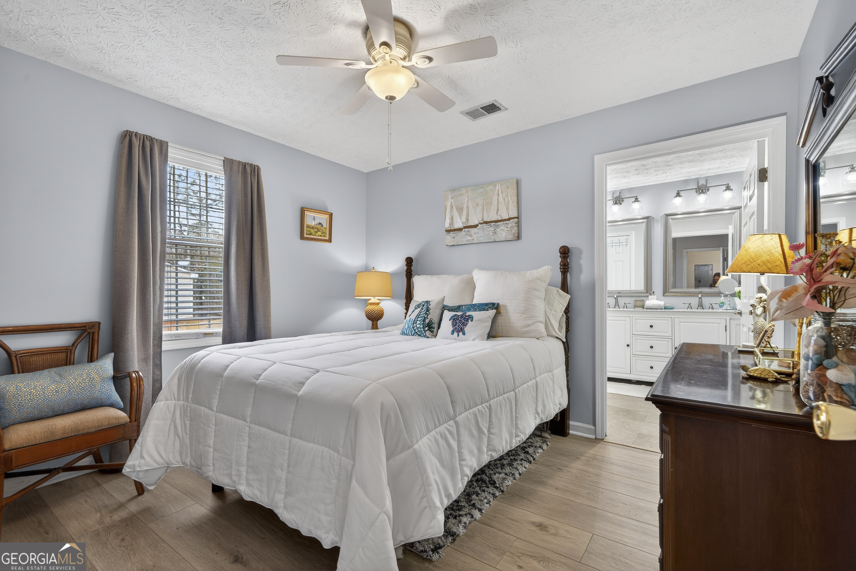 285 Clubhouse Road Eatonton, GA 31024 - Photo 26 of 44 a bedroom with bed and window