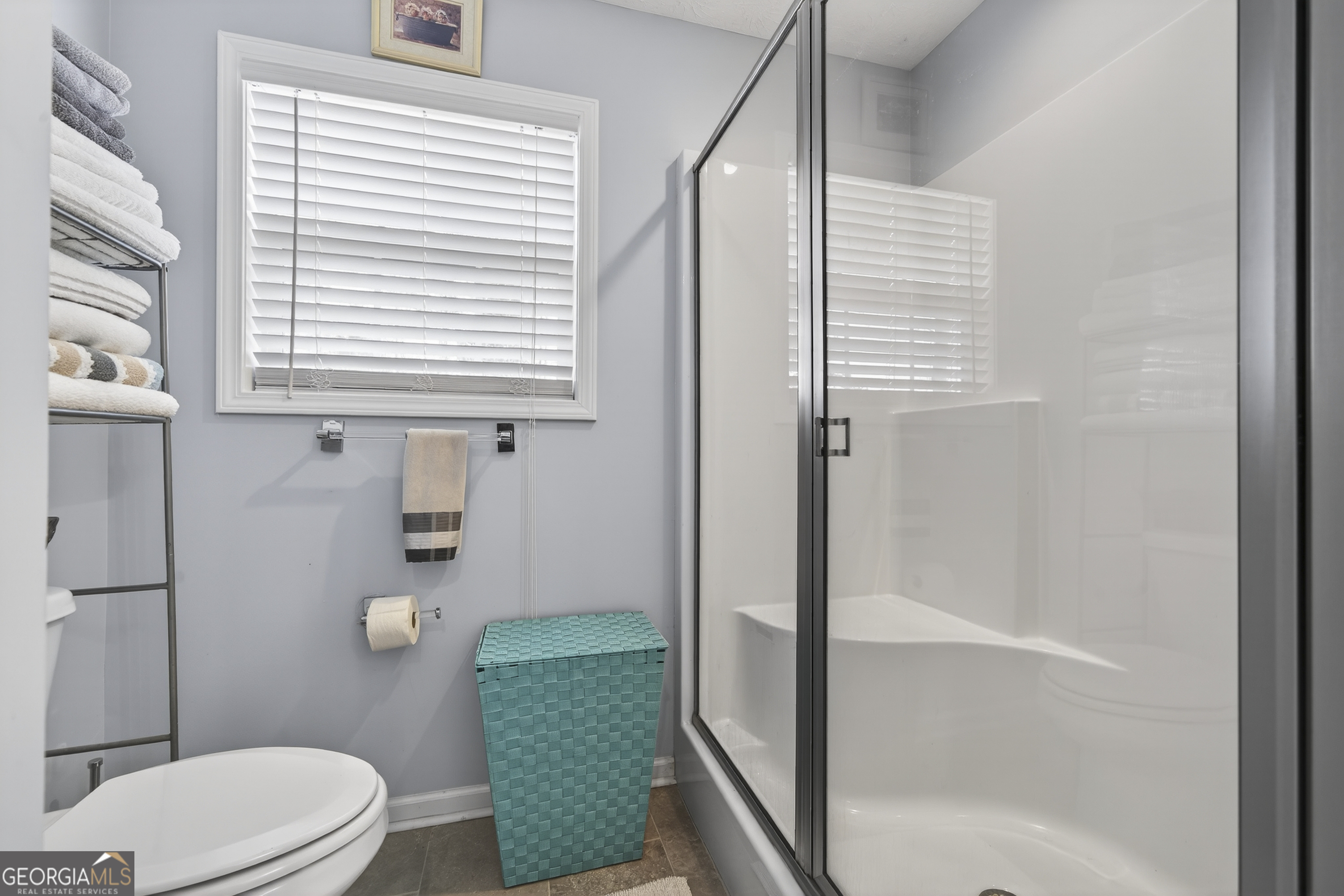 285 Clubhouse Road Eatonton, GA 31024 - Photo 28 of 44 a bathroom with a toilet a sink and shower