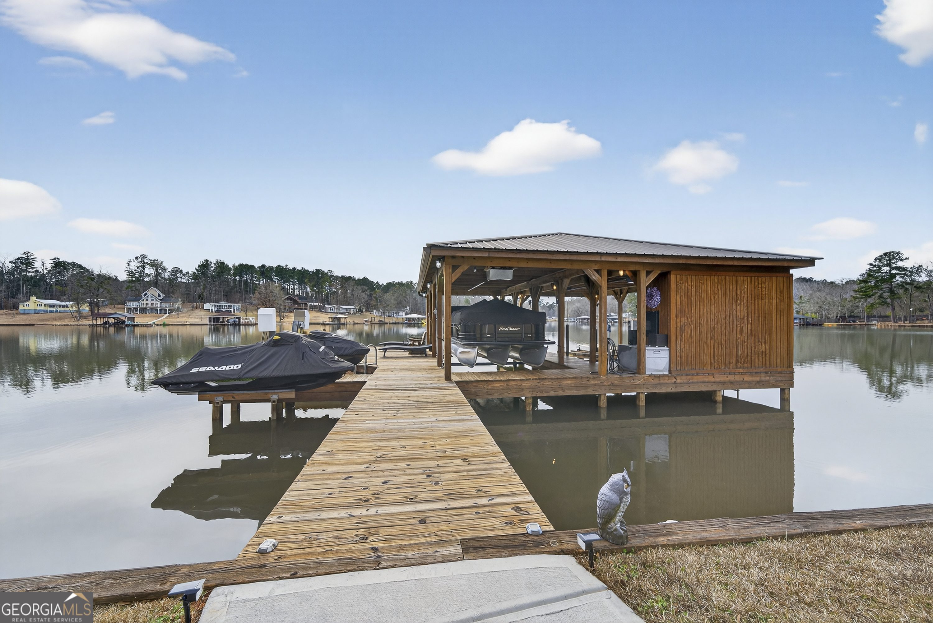 285 Clubhouse Road Eatonton, GA 31024 - Photo 3 of 44 a front view of a house with lake view