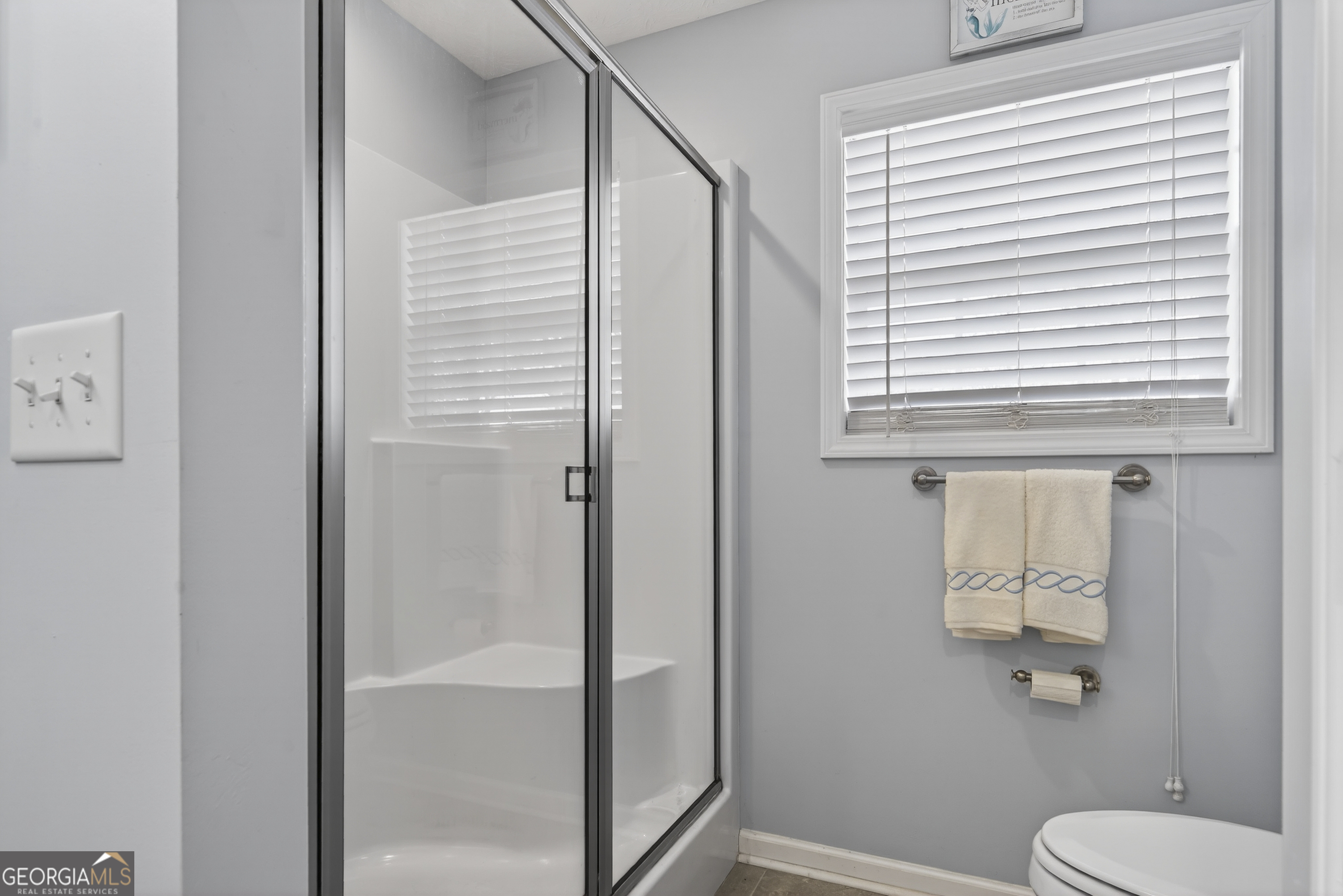 285 Clubhouse Road Eatonton, GA 31024 - Photo 33 of 44 a bathroom with a toilet and a shower