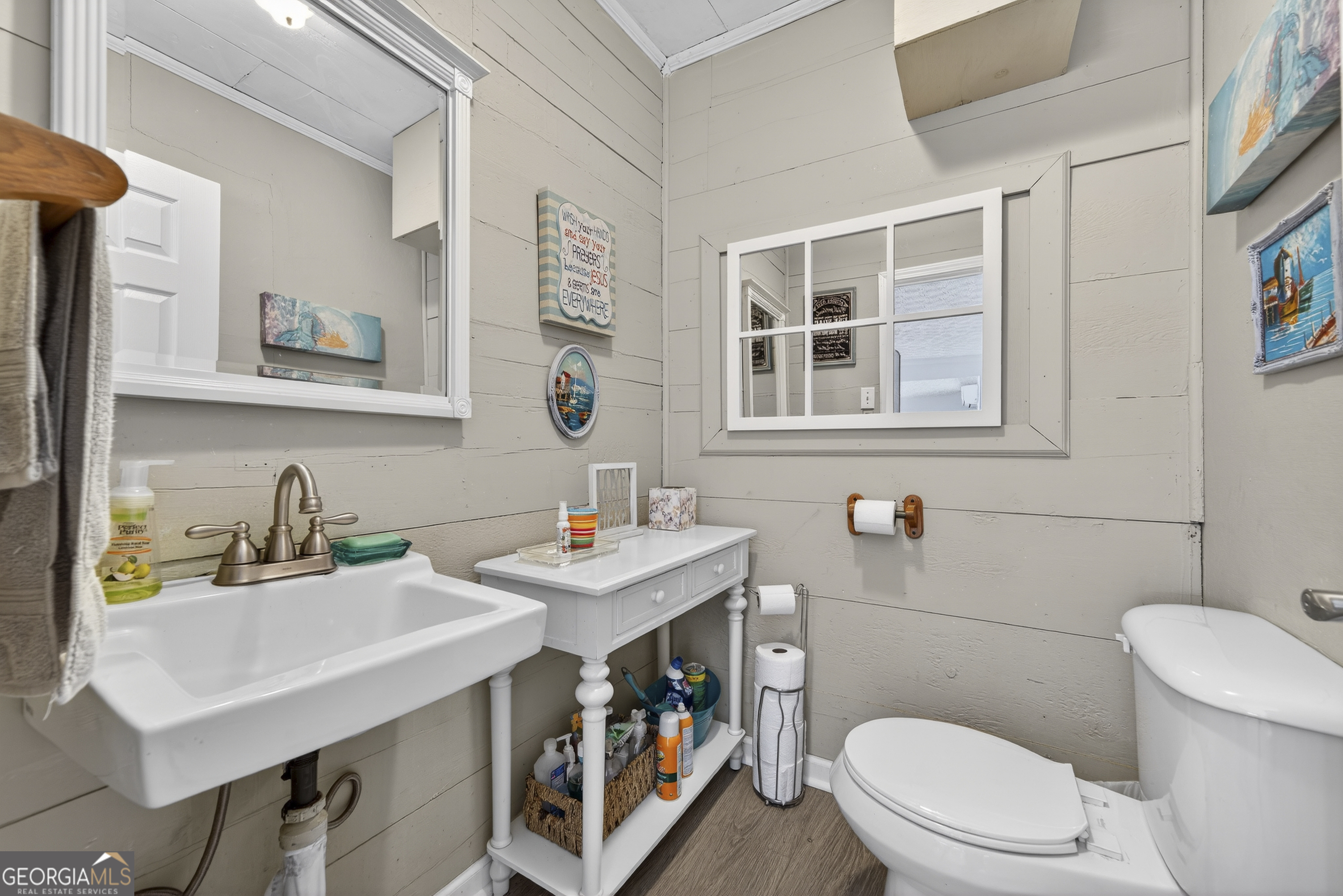 285 Clubhouse Road Eatonton, GA 31024 - Photo 35 of 44 a bathroom with a sink a toilet and a mirror