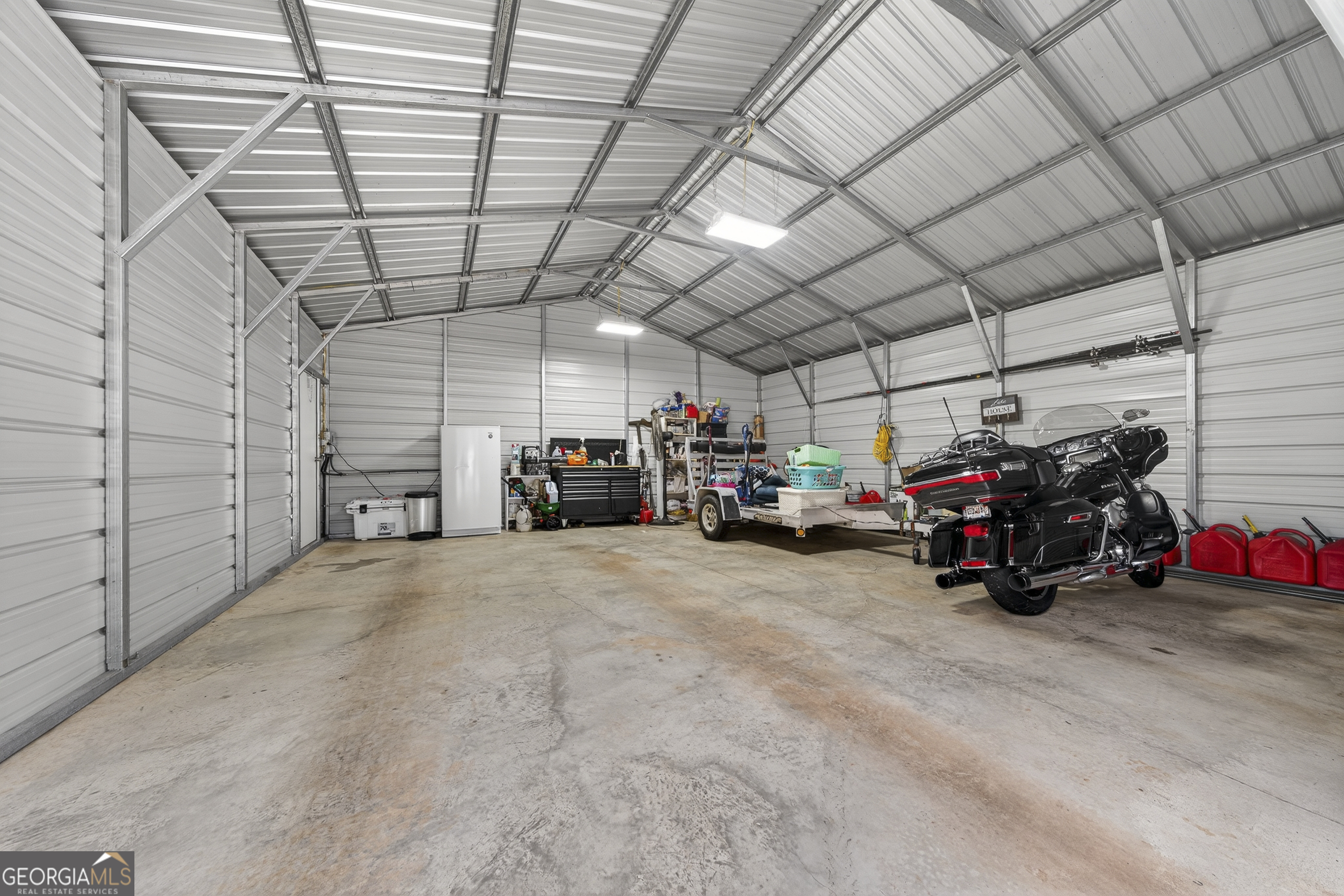 285 Clubhouse Road Eatonton, GA 31024 - Photo 37 of 44 a view of a garage with storage
