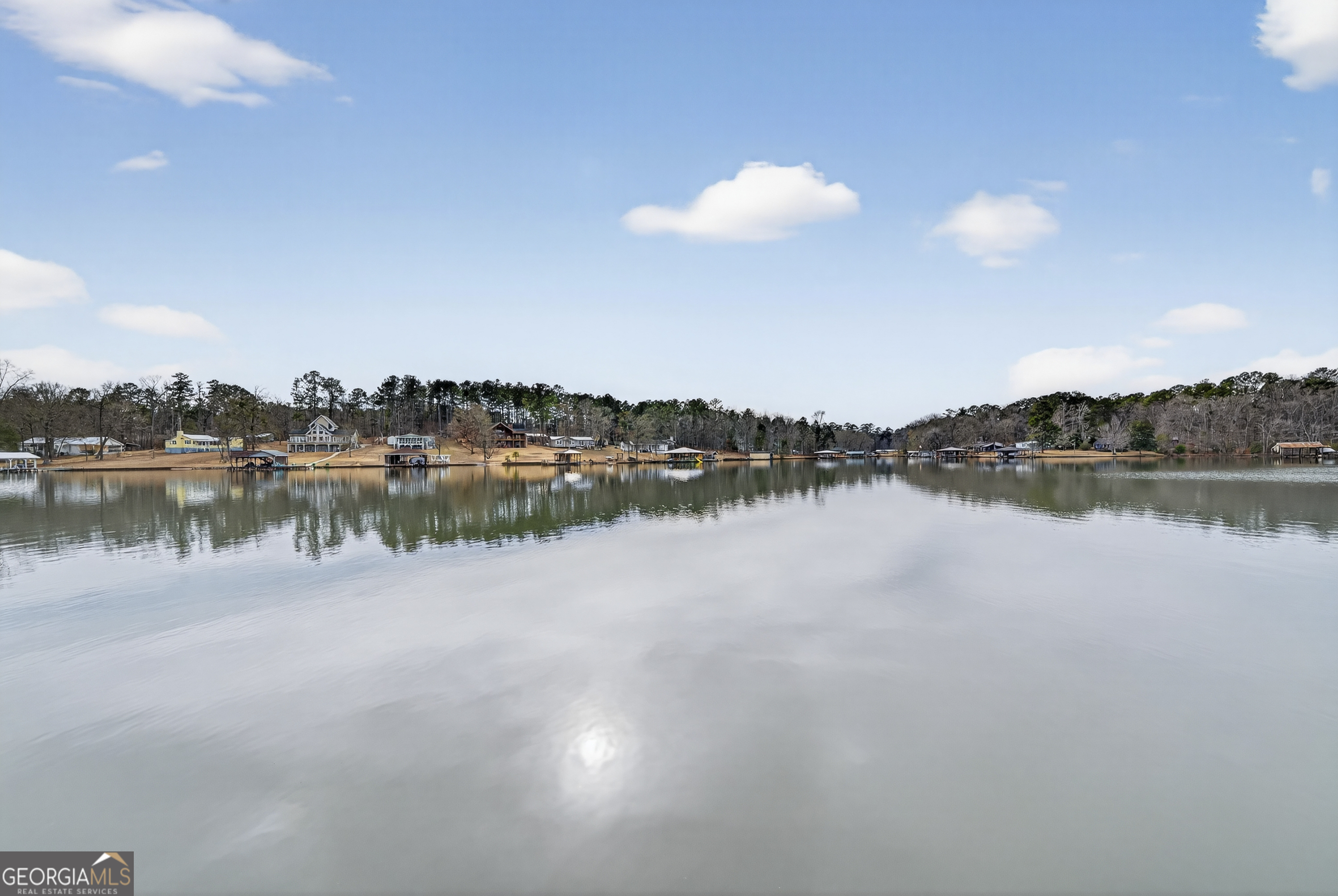 285 Clubhouse Road Eatonton, GA 31024 - Photo 40 of 44 a view of a lake with houses