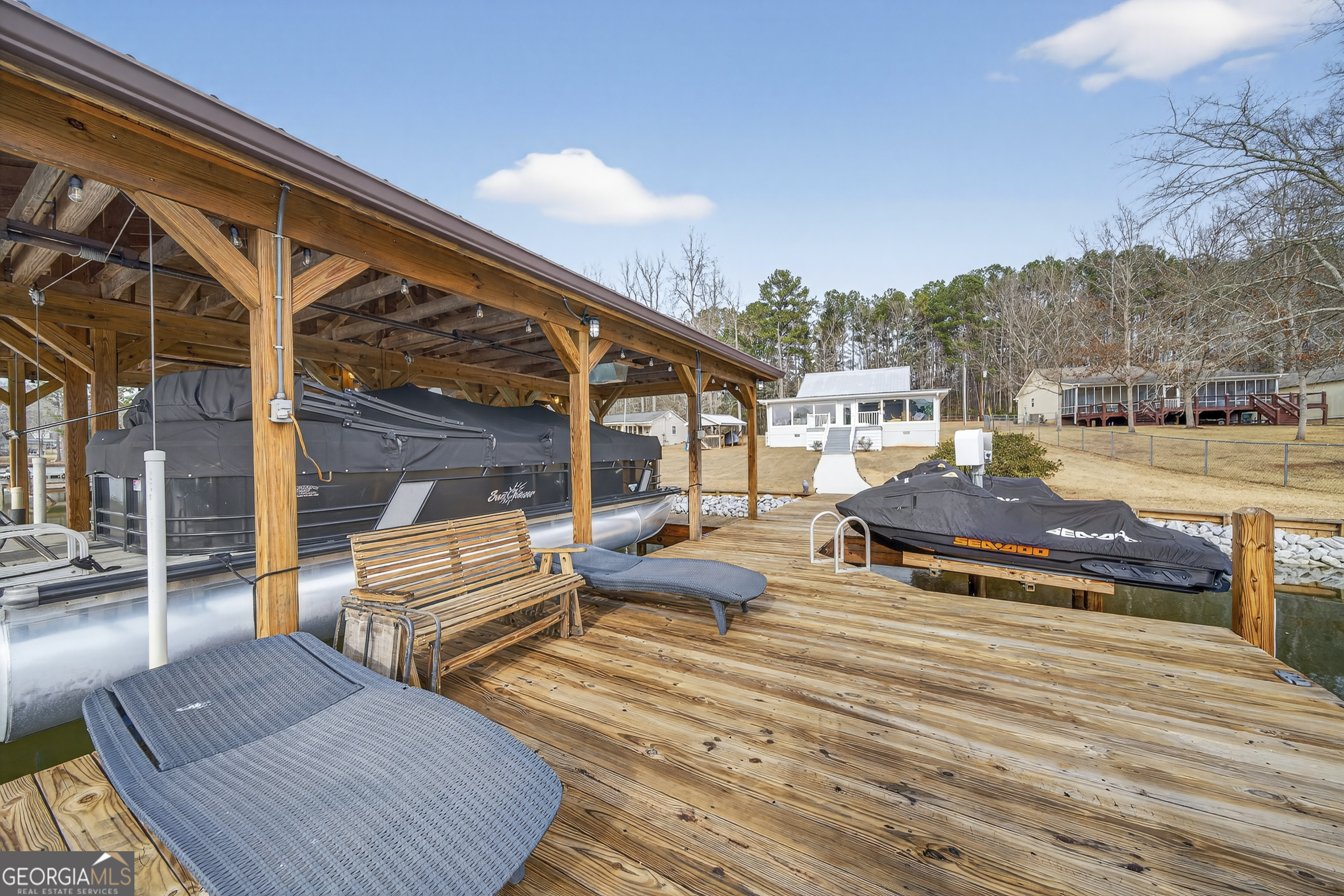 285 Clubhouse Road Eatonton, GA 31024 - Photo 4 of 44 a view of a patio with couches and pool
