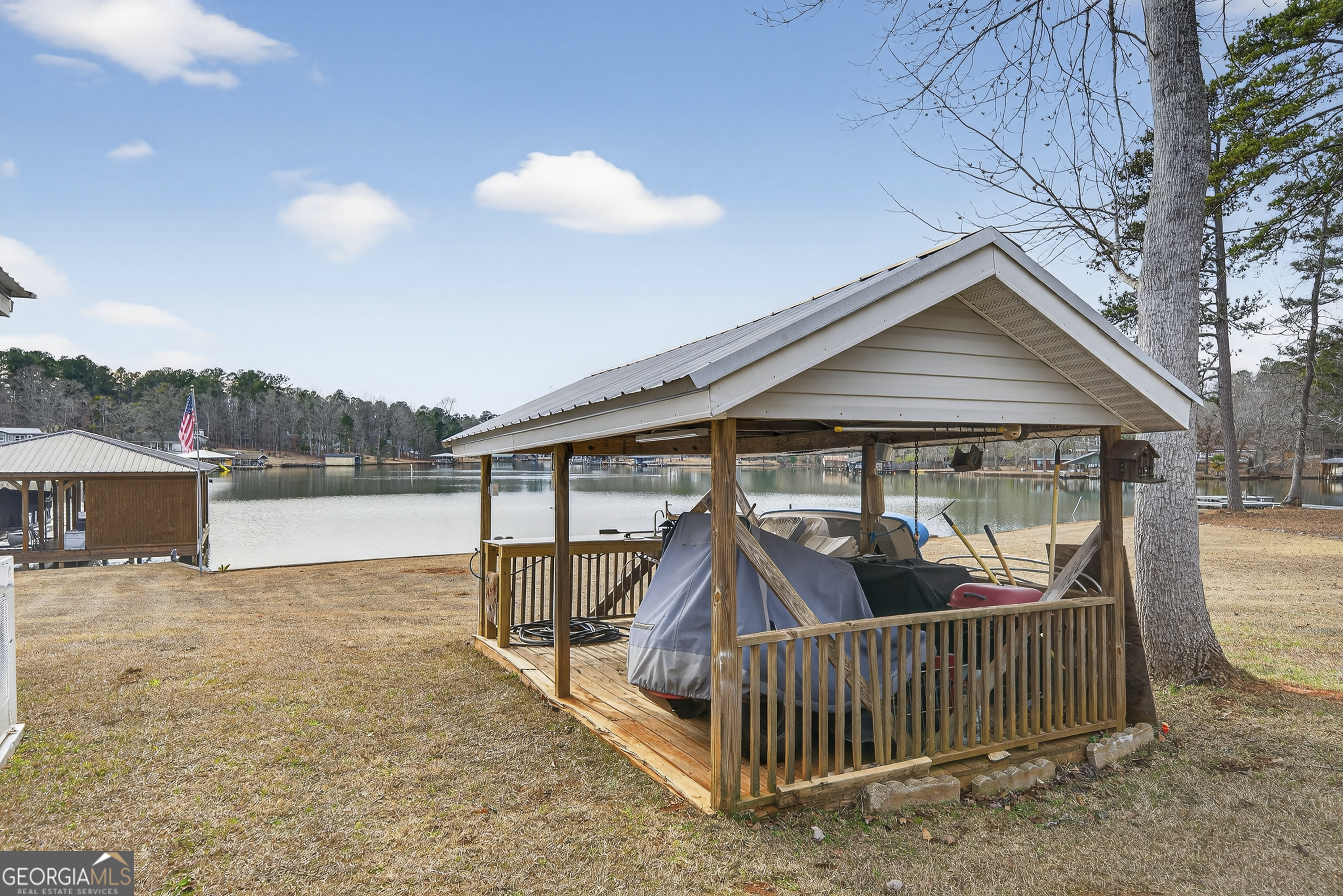 285 Clubhouse Road Eatonton, GA 31024 - Photo 42 of 44 a view of house with a yard and deck