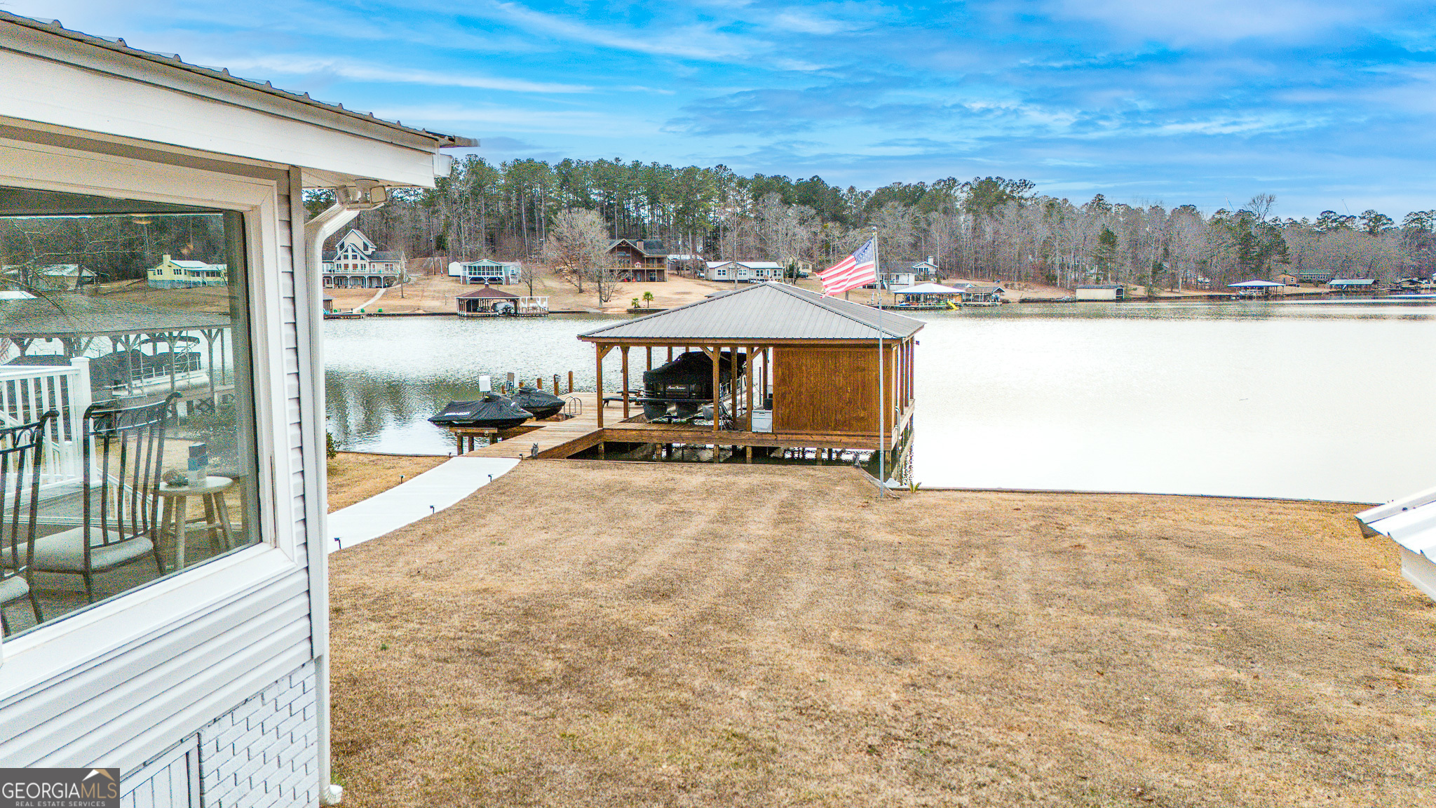 285 Clubhouse Road Eatonton, GA 31024 - Photo 6 of 44 a view of a swimming pool and trees in the background
