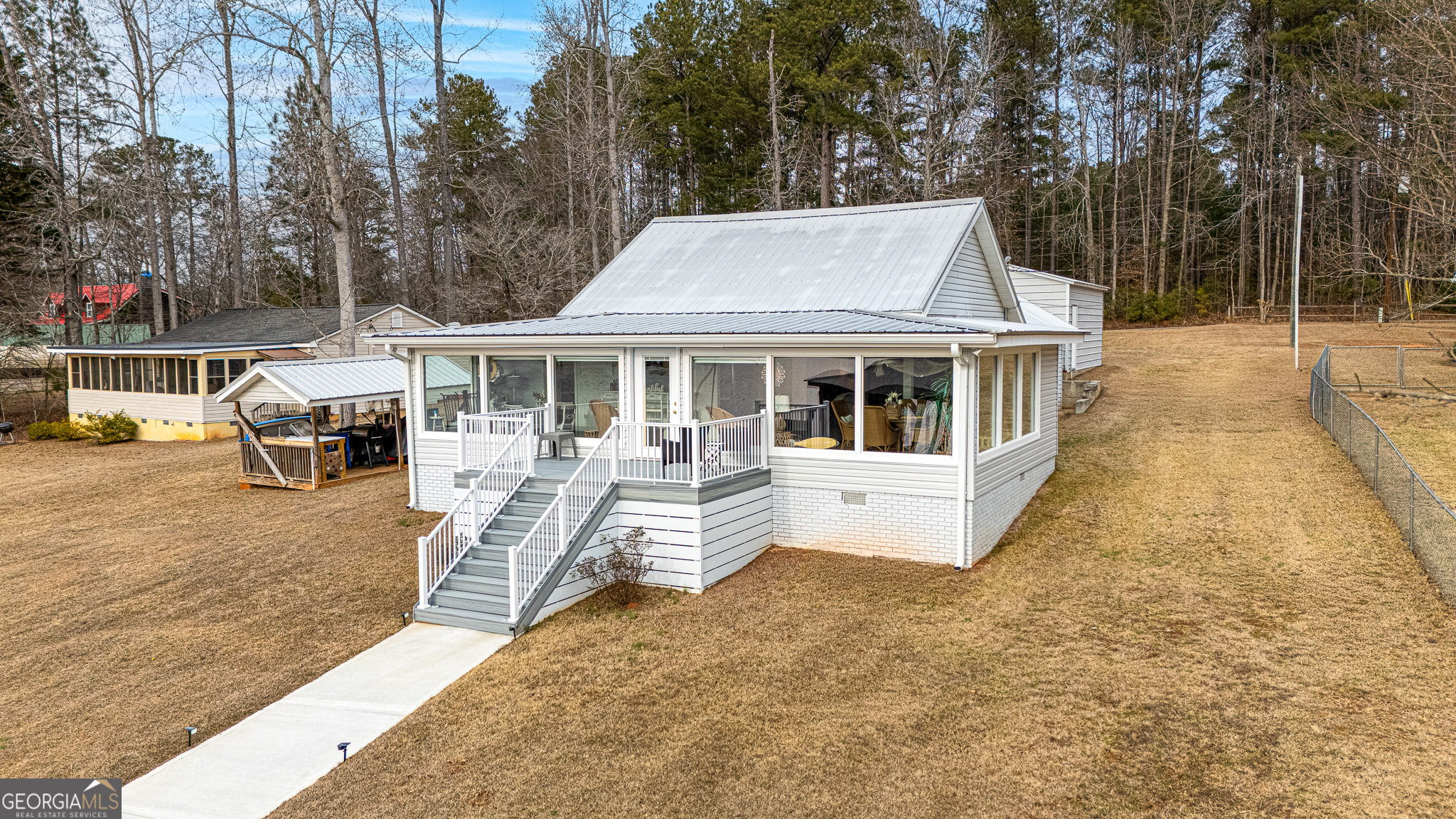 285 Clubhouse Road Eatonton, GA 31024 - Photo 10 of 44 a view of residential houses with yard and trees