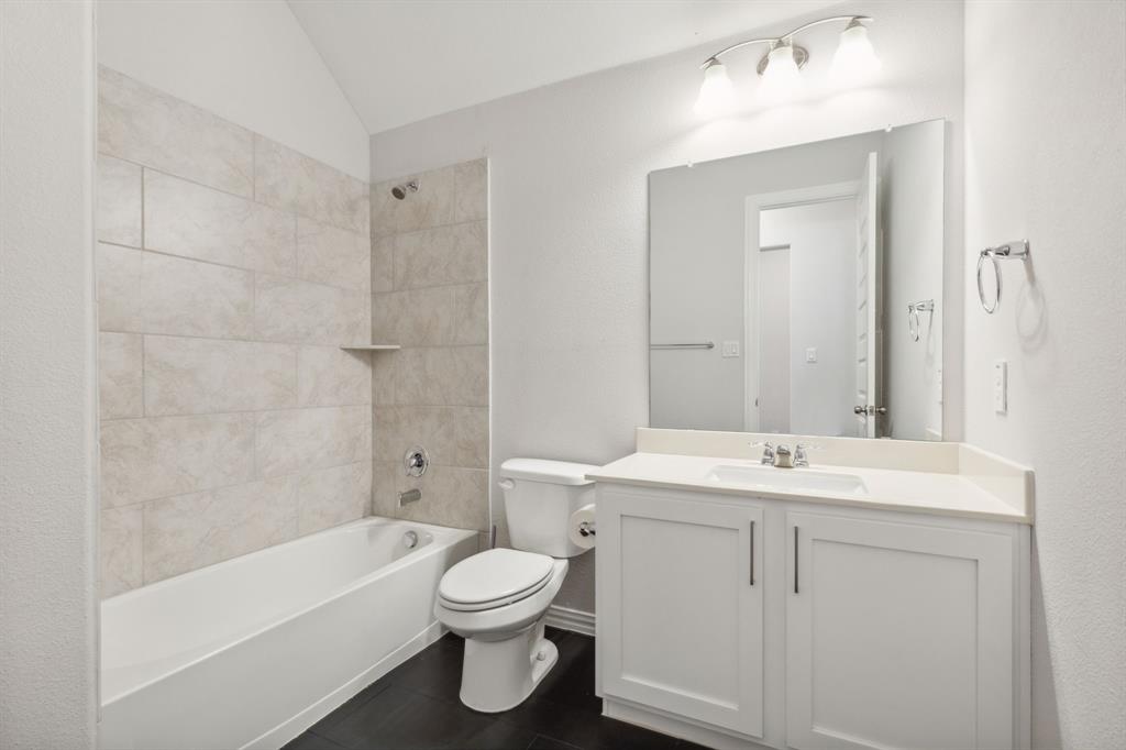 1918 Holy Unity Lane Wylie, TX 75098 - Photo 11 of 19 a bathroom with a sink a toilet and shower