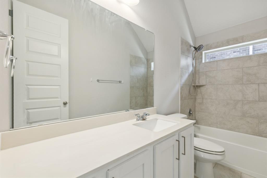 1918 Holy Unity Lane Wylie, TX 75098 - Photo 13 of 19 a bathroom with a sink and a mirror