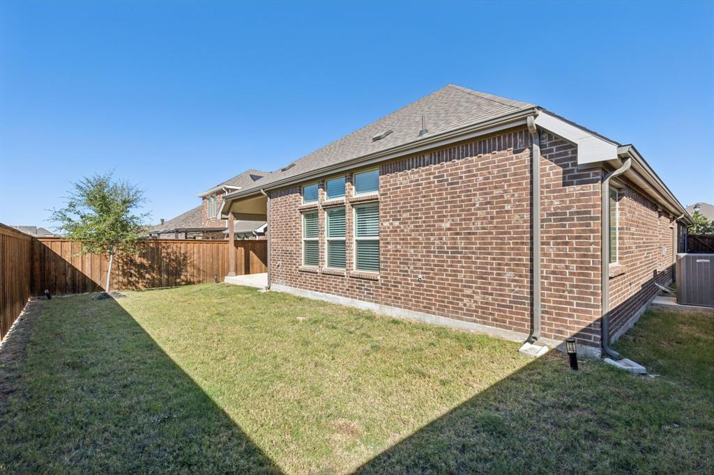 1918 Holy Unity Lane Wylie, TX 75098 - Photo 15 of 19 a view of a house with backyard