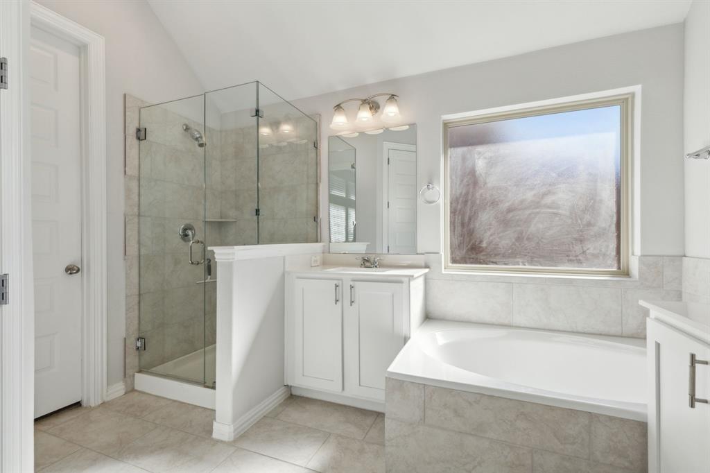 1918 Holy Unity Lane Wylie, TX 75098 - Photo 8 of 19 a bathroom with a bathtub a sink and a shower