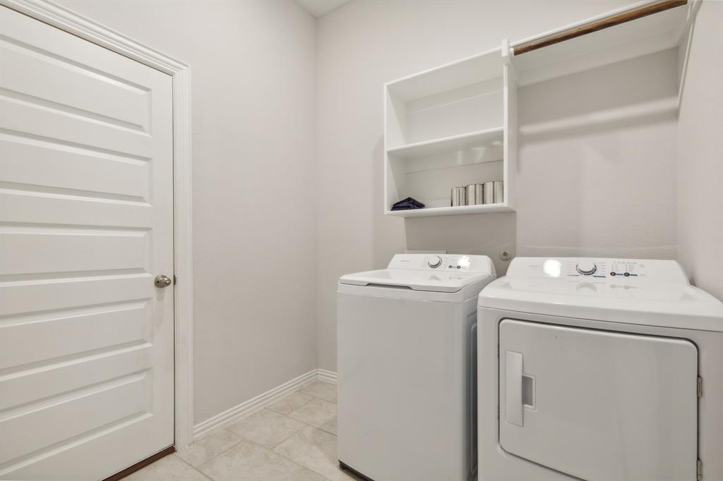 1918 Holy Unity Lane Wylie, TX 75098 - Photo 9 of 19 a view of storage and utility room with washer and dryer
