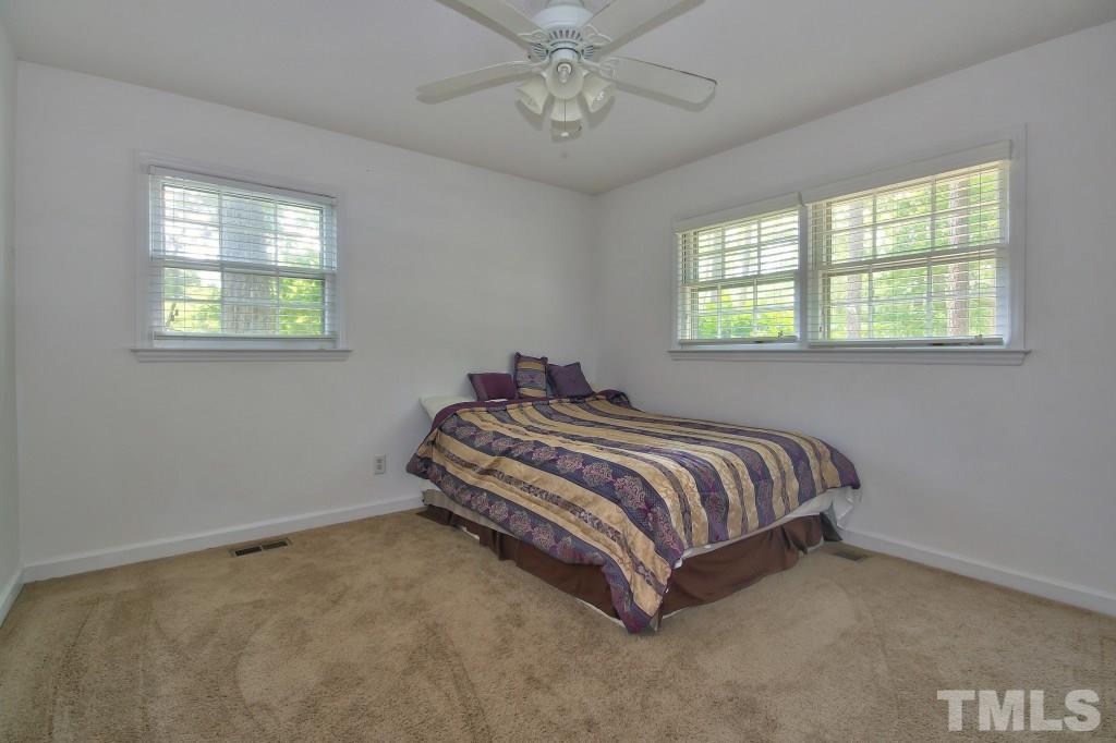 1632 Marshburn Road Wendell, NC 27591 - Photo 13 of 19 All the bedrooms feature carpeting and have ceiling fans and large closets.