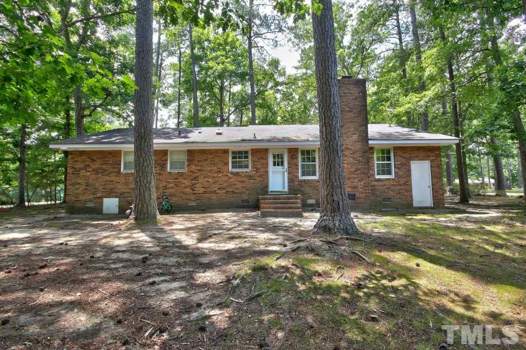 1632 Marshburn Road Wendell, NC 27591 - Photo 16 of 19 .81 of an acre is a lot of land to work with! Partially cleared in the back with a porch.