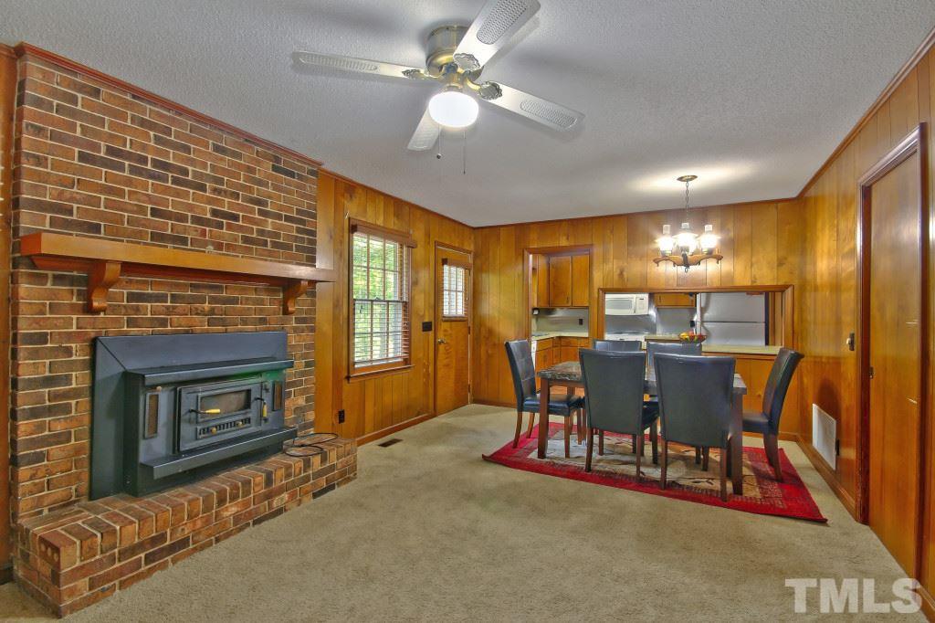 1632 Marshburn Road Wendell, NC 27591 - Photo 7 of 19 Large family room to entertain family and friends in! Wood burning fireplace to cozy up to during our NC winters! Has carpet and a ceiling fan to cool you off in the summer.