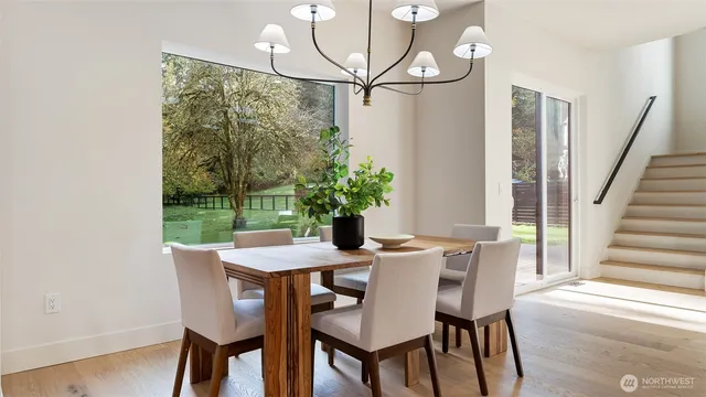 a bathroom with a granite countertop toilet and a sink
