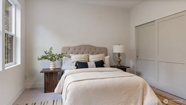 a bathroom with a granite countertop sink a toilet and a mirror