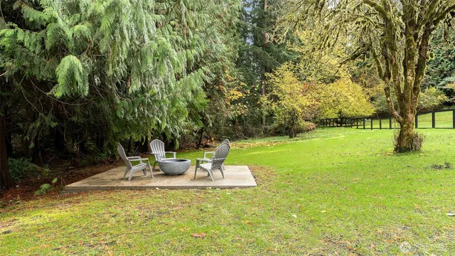 a view of field with trees in the background