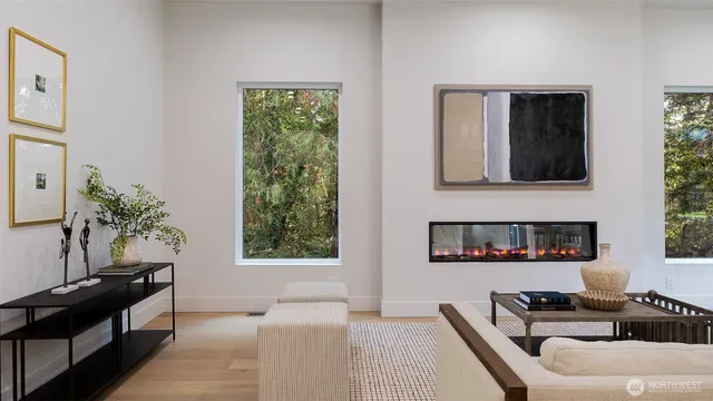 a dining room with furniture a chandelier and wooden floor