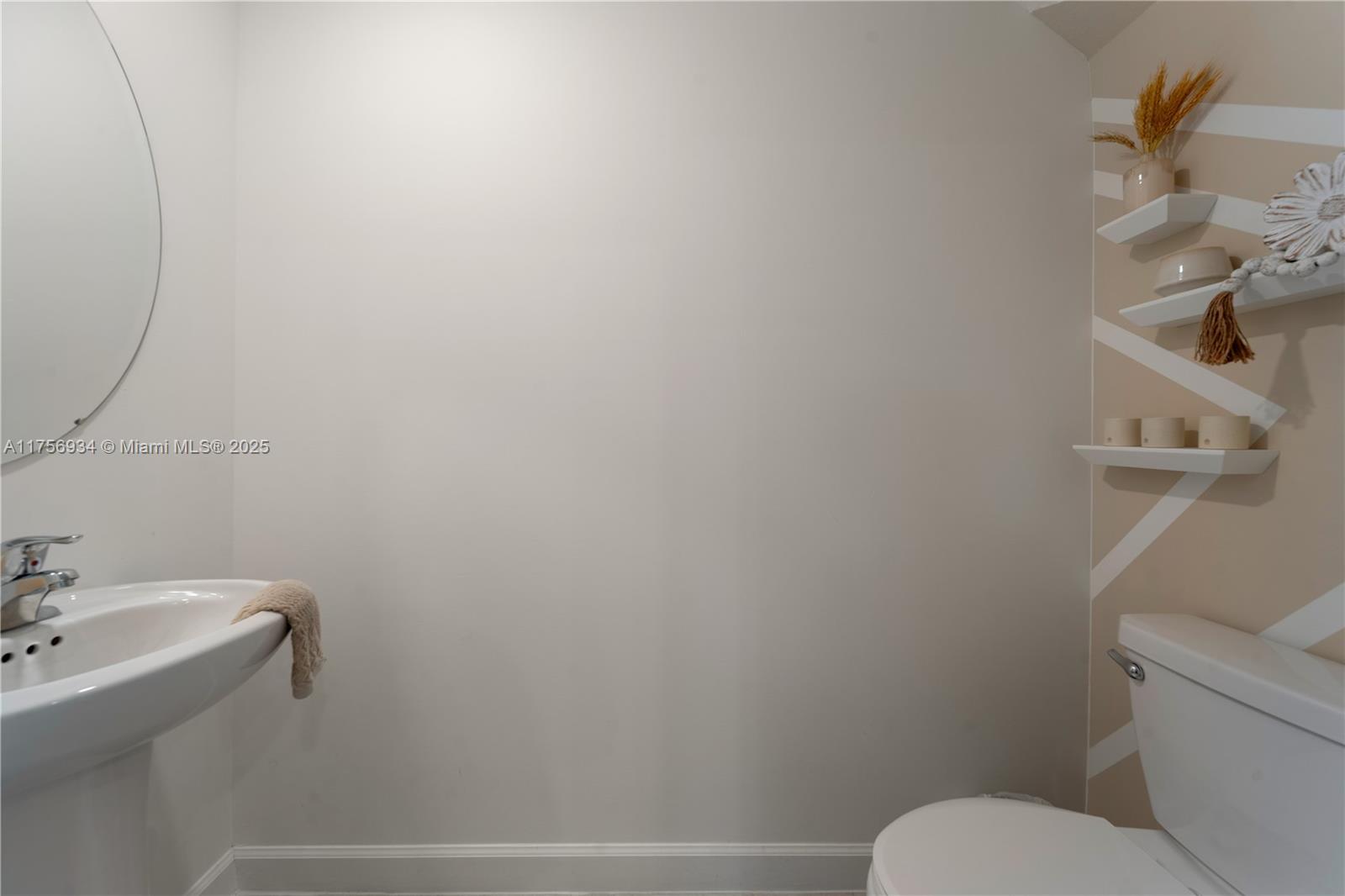 26431 Southwest 148th Avenue Homestead, FL 33032 - Photo 11 of 29 a bathroom with a toilet and a sink