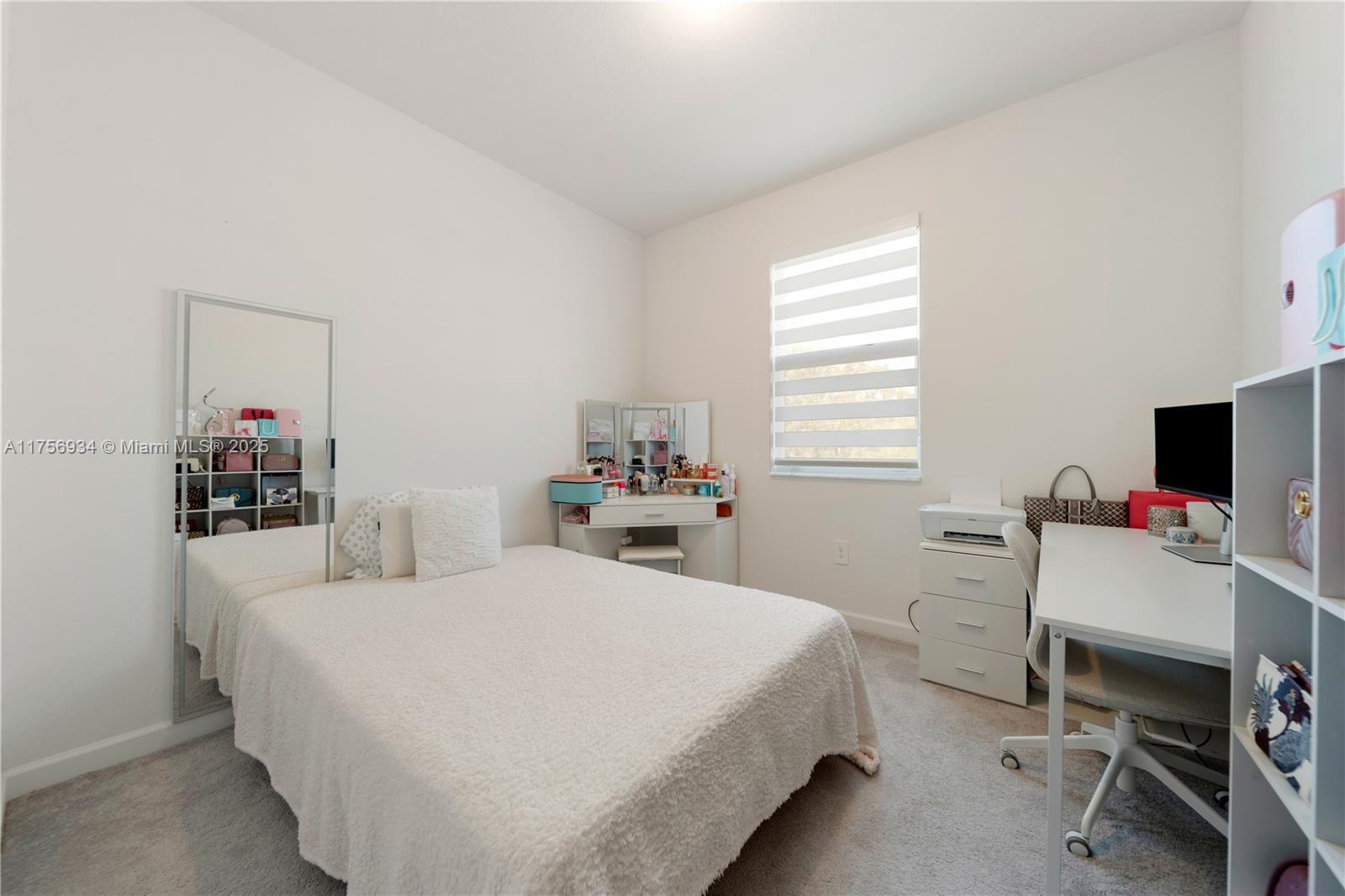 26431 Southwest 148th Avenue Homestead, FL 33032 - Photo 20 of 29 a bedroom with a bed and a desk