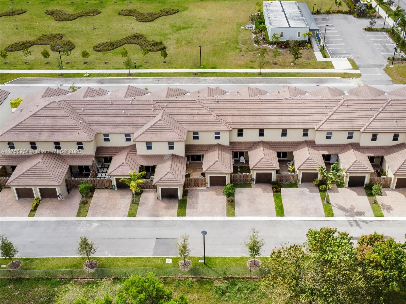 26431 Southwest 148th Avenue Homestead, FL 33032 - Photo 26 of 29 an aerial view of residential houses with outdoor space