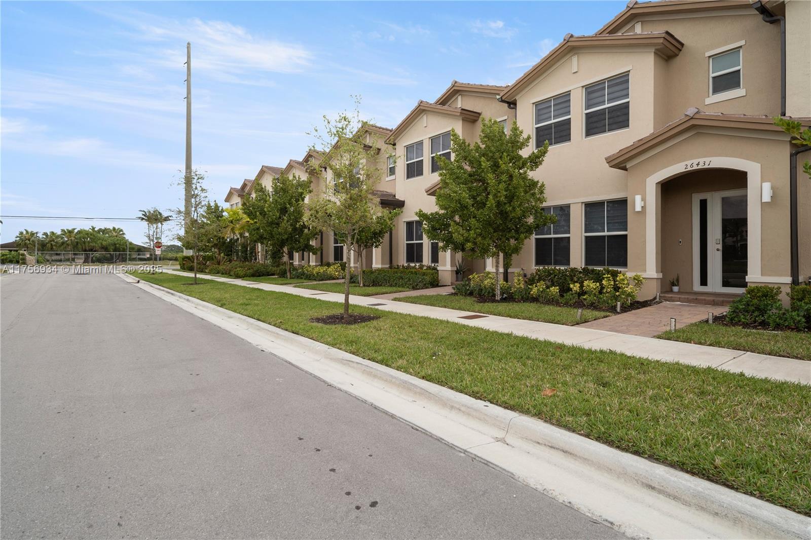 26431 Southwest 148th Avenue Homestead, FL 33032 - Photo 29 of 29 a front view of a house with a yard