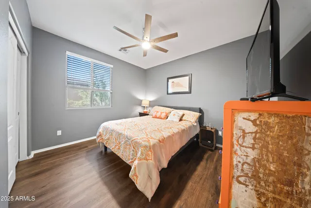 a bedroom with bed and window