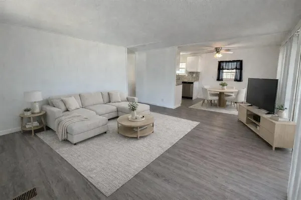 a bathroom with a double vanity sink toilet mirror and shower