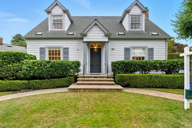 front view of a house with a yard