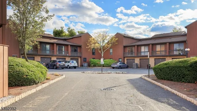 front view of a house with a garden