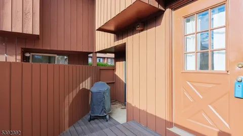 a view of entryway with wooden floor and stairs