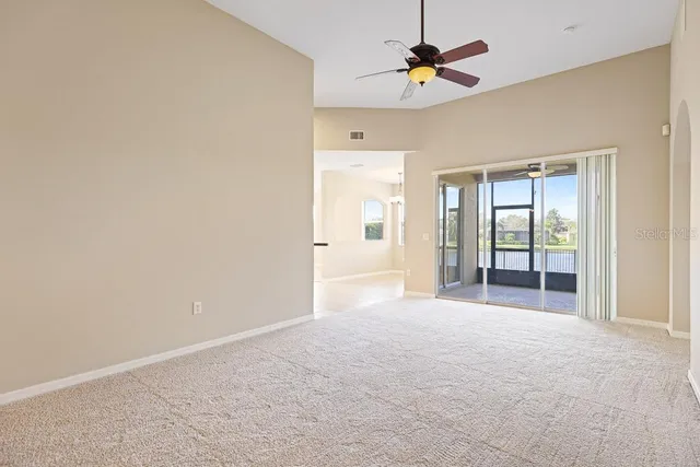 a view of a kitchen with a sink and a refrigerator