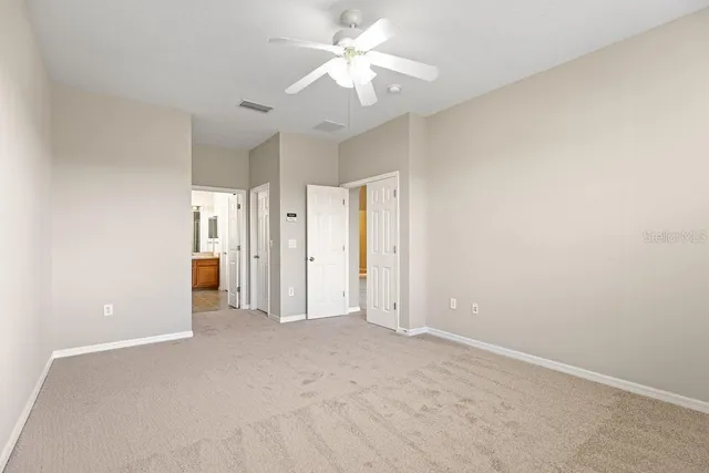 a bathroom with a granite countertop sink a bathtub window and shower