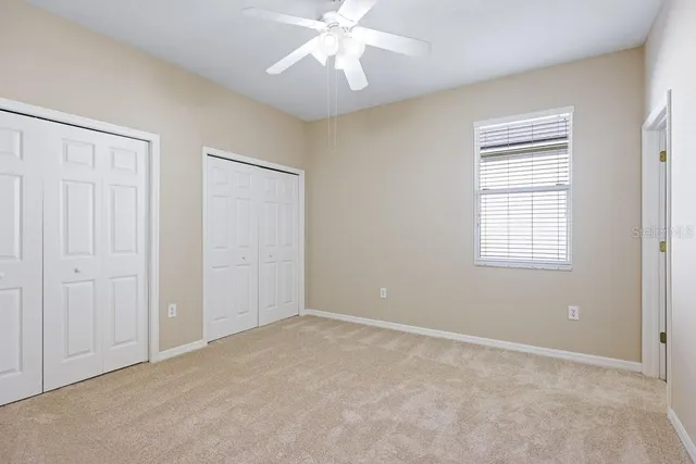 an empty room with a bathroom and a sink