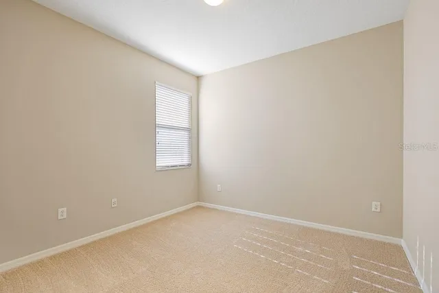 a bathroom with a toilet a sink a mirror a bathtub and vanity